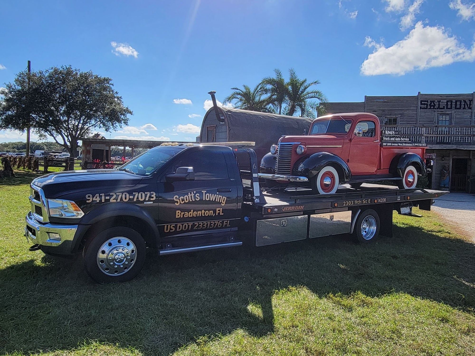 Scott's Towing truck with vintage red pickup